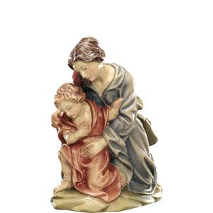 Donna inginocchiata con bambino