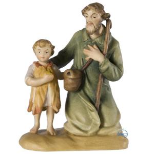 Shepherd kneeling with child