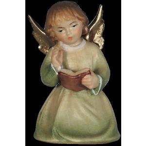 Christmas angel kneeling with book