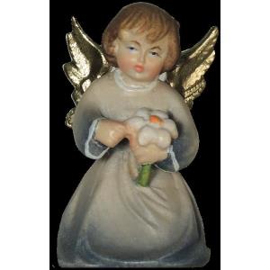 Christmas angel kneeling with flower