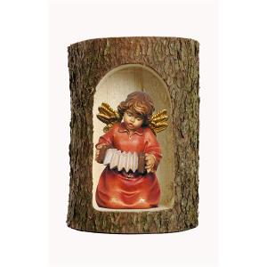 Bell angel with accordion in a tree trunk