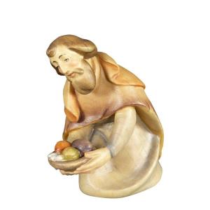 Shepherd with presents kneeling