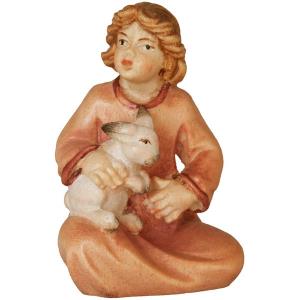 Girl sitting with rabbit