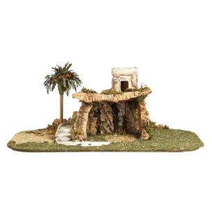 Stall mit Turm und Palme