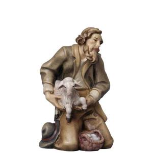 Hirte kniend mit Schaf