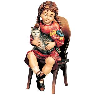 Sitting girl with cat on chair