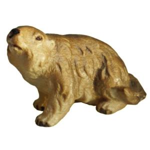 Cucciolo di marmotta seduto da sinistra