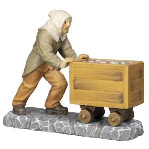 Mountain miner pushes mining cart